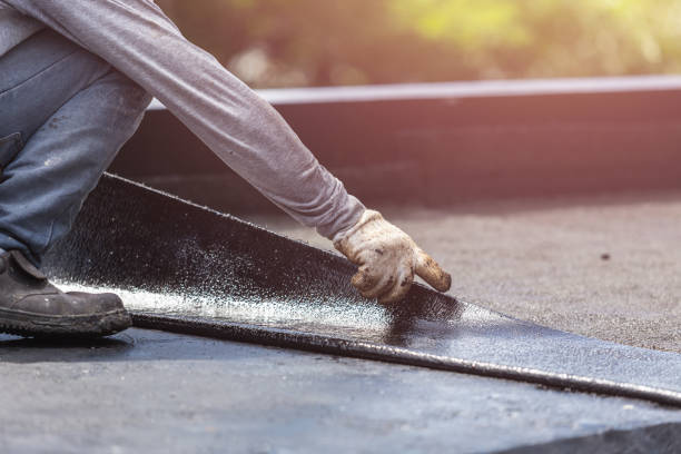 Professional Basement Waterproofing technician working in Baldwin, WI